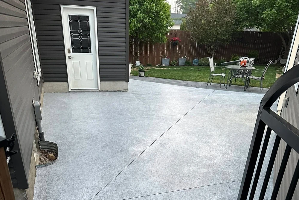 A newly sealed asphalt driveway looking clean and black.